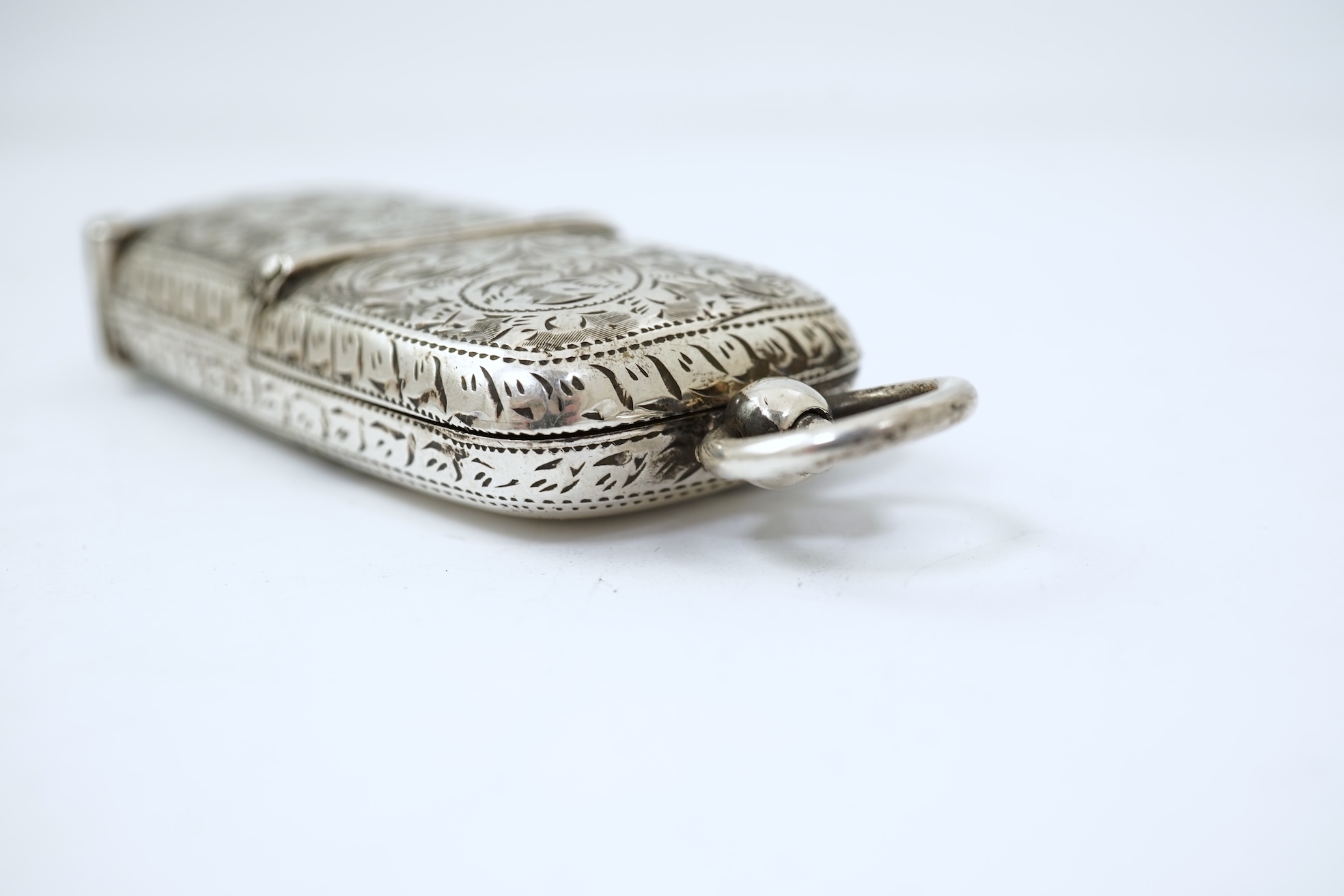 A late Victorian engraved silver oval combination sovereign and vesta case, by W H Tandy & Sons
